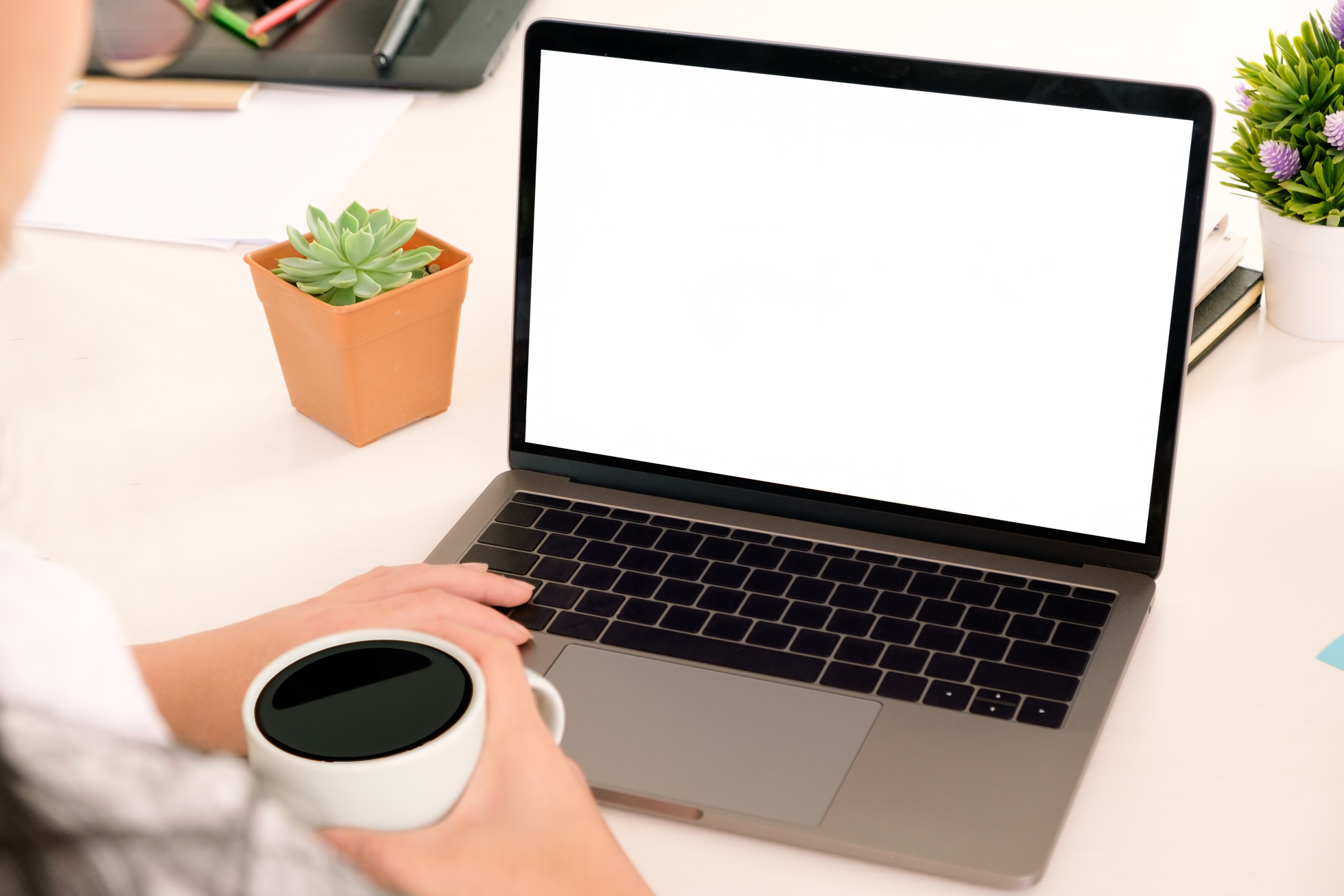 Woman Using Mock up Laptop Computer with Coffee on Hand, Empty S